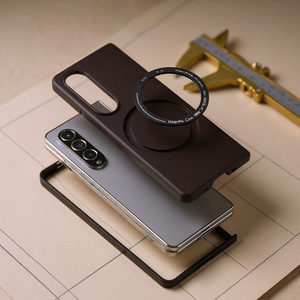 Foldable phone case measured with a brass caliper on cream drafting paper — planning the best Galaxy Z Fold 8 cases before launch